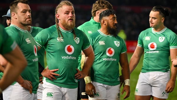 Ireland's players look on with disappointment after the final whistle