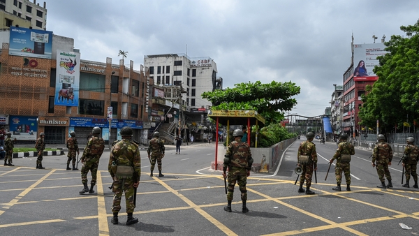 A government curfew went into effect at midnight and the premier's office asked the military to deploy troops