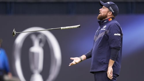 Shane Lowry reacts after a missed putt on 18