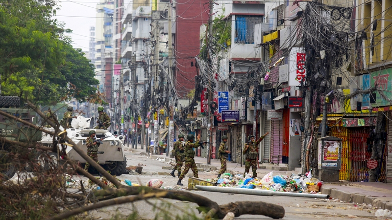 Bangladeshi soldiers patrol the streets to disperse the anti-quota protesters in Dhaka