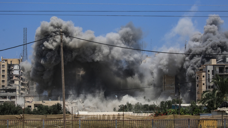 Smoke rises from a building hit by an Israeli strike in Nuseirat in central Gaza