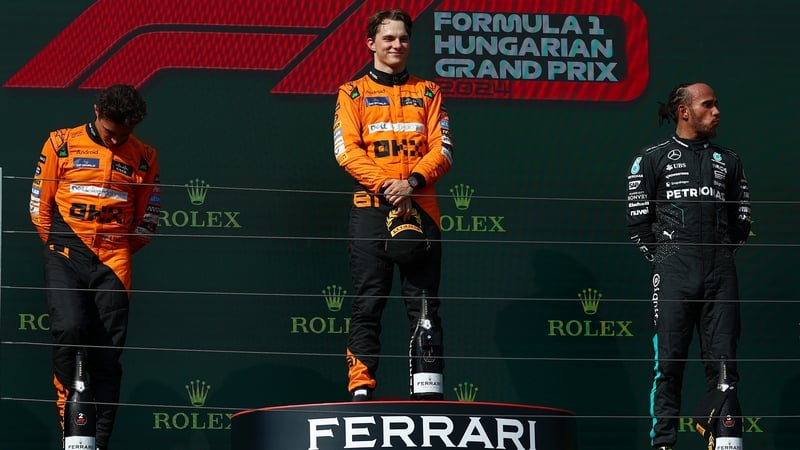 Oscar Piastri (centre) claimed victory at the Hungarian Grand Prix