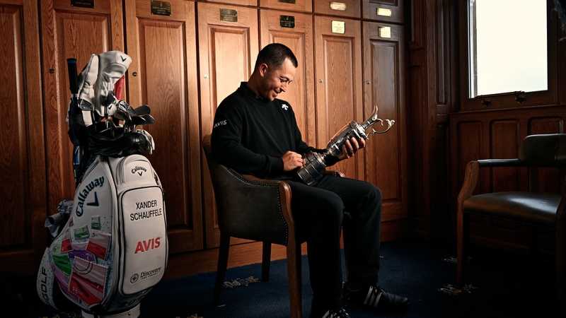 Xander Schauffele inspects the Claret Jug after winning the 152nd Open at Royal Troon