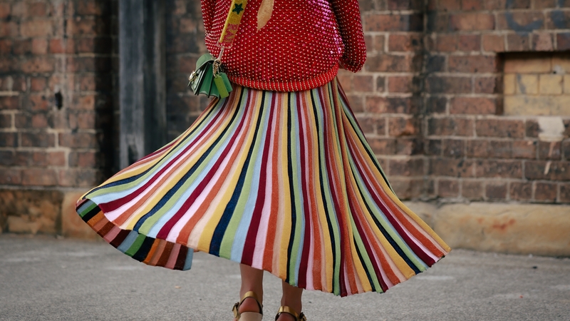 Eddie Riley Rainbow with a green Coach bag during Australian Fashion Week 2024 in Sydney. Photo: Hanna Lassen/Getty Images