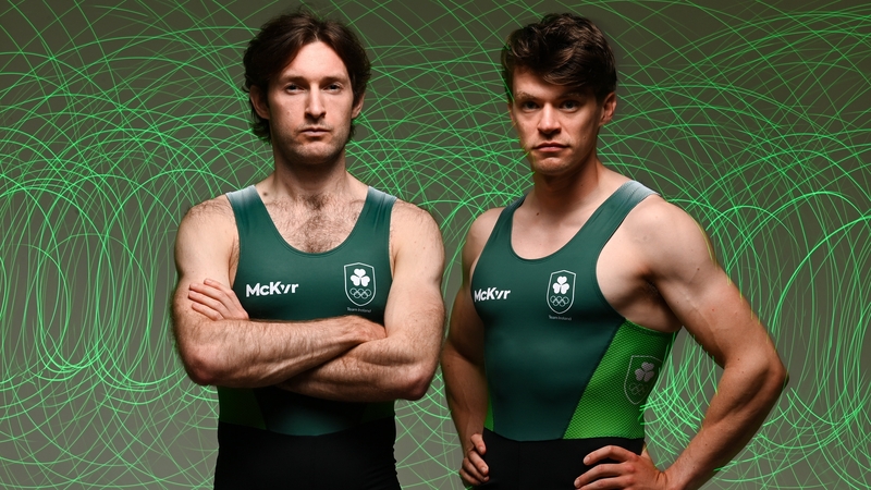 Paul O'Donovan (L) and Fintan McCarthy are in rowing action