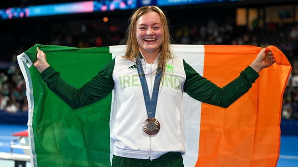 Mona McSharry poses with her Olympic bronze medal and the Irish tricolour