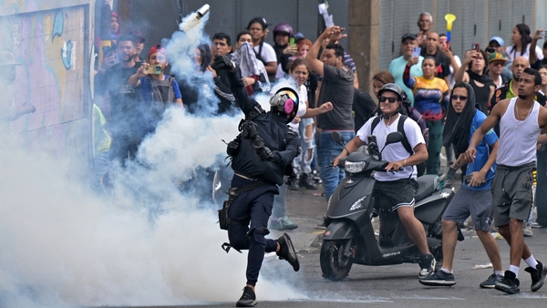 Security forces dispersed protesters using tear gas after Venezuela's electoral council announced that Maduro won re-election to a third six-year term