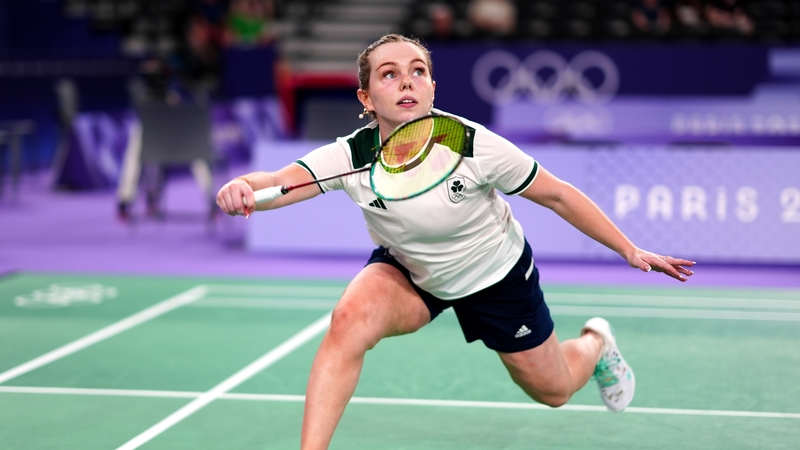 Rachael Darragh runs towards the shuttle inside the Adidas Arena