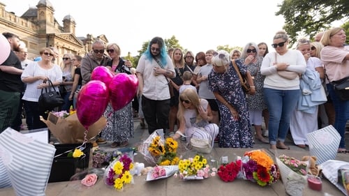 Members of the public gathered outside Southport's Atkinson arts venue to pay their respects