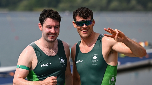 Daire Lynch (L) and Philip Doyle celebrate Ireland's first heavyweight rowing medal