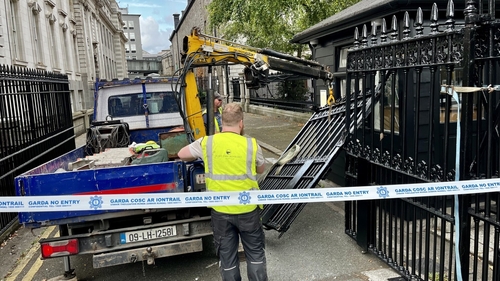The gates at the Office of the Attorney General are removed after they were damaged overnight