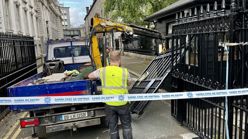 The gates at the Office of the Attorney General are removed after they were damaged overnight