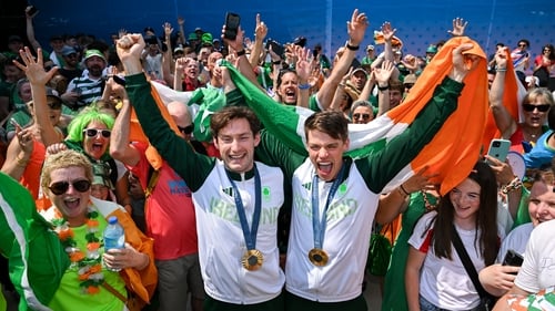 Paul O'Donovan (l) and Fintan McCarthy shared their joy with the huge number of Irish fans who descended on Vaires-sur-Marne