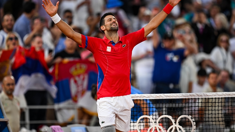 Novak Djokovic celebrates beating Lorenzo Musetti