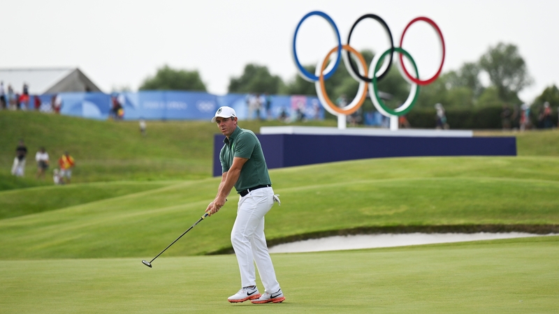 McIlroy reacts after a missed putt on the 18th green