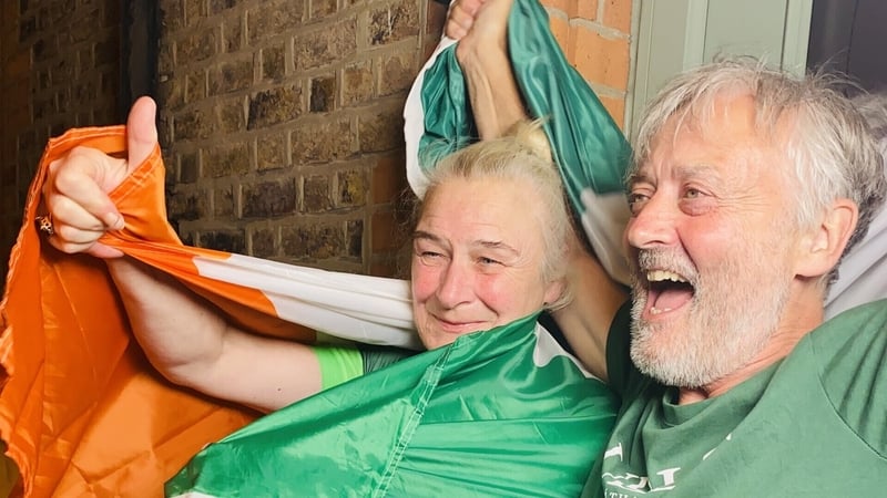 Yvonne and Christie Harrington celebrate their daughter's second olympic gold medal win outside their home on Portland Row