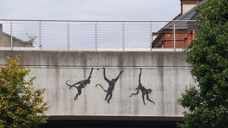 A new artwork depicting three monkeys unveiled by Banksy, painted on a bridge in Brick Lane, east London