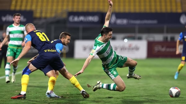 Neil Farrugia of Shamrock Rovers lunges for a tackle
