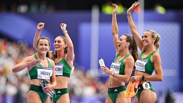 Phil Healy, Kelly McGrory, Sophie Becker, and Sharlene Mawdsley acknowledge Irish fans in the crowd after advancing to the final