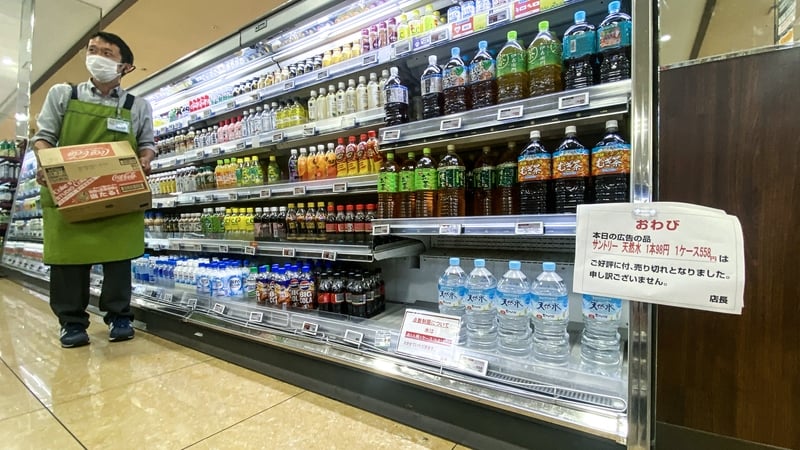 A sign saying 'bottled water is being rationed' is seen in a supermarket in Sumida district of Tokyo