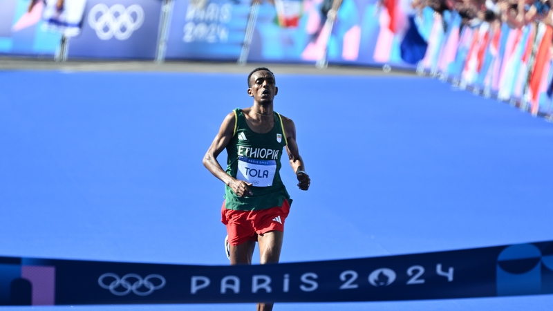 Tamirat Tola approaches the finish line in the marathon