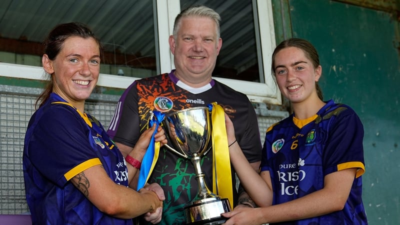 Co-captains Aoife Connolly and Casey Kelly accept the Nancy Murray cup
