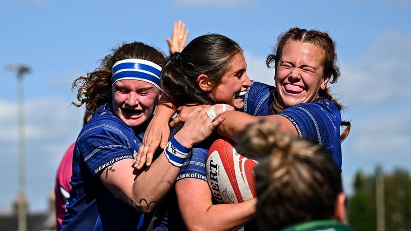 Ella Roberts (centre) celebrates Leinster's opening try