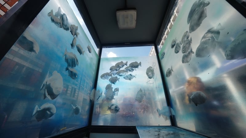 The artist appears to have used translucent spray paint on the glass windows