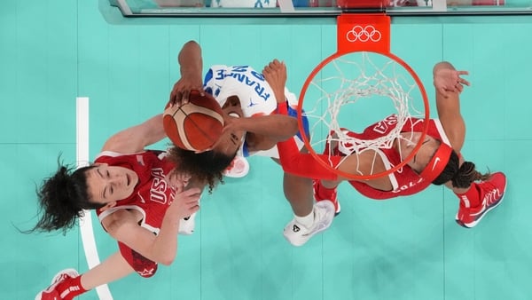France's Marieme Badiane goes to the basket as USA's Breanna Stewart (L) and A'ja Wilson try to block