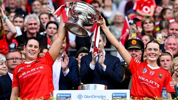 Cork joint-captains Molly Lynch, left, and Meabh Cahalane lift the O'Duffy Cup