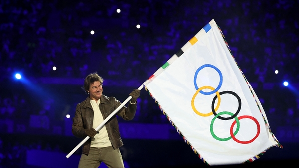 Movie Star Tom Cruise drew gasps from spectators as he dropped 50m to the floor of the Stade de France in the finale to the Paris Games