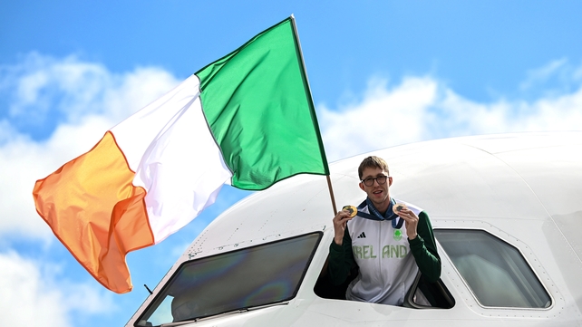 Dual medalist Daniel Wiffen, who won gold in the 800m freestyle and bronze in the 1500m event, poses in the cockpit...