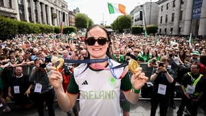 Kellie Harrington shows off her gold medals from Tokyo and Paris in front of thousands of fans