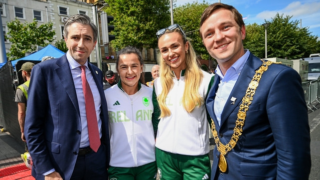 Taoiseach Simon Harris (L) and Lord Mayor of Dublin James Geoghegan (R) with sprinters Phil Healy and Sharlene Mawdsley