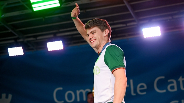 Rower Fintan McCarthy waves to the crowd from the stage on O'Connell Street