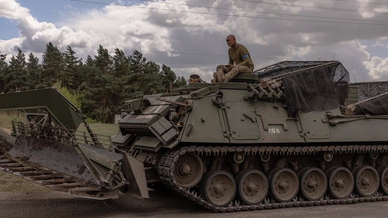 Ukrainian servicemen operate an armoured military vehicle in the Sumy region, near the border with Russia