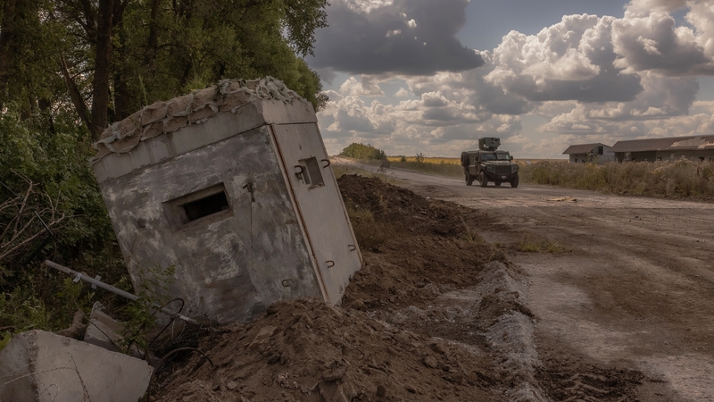 Ukrainian soldiers drive past a destroyed border crossing point with Russia in Kursk. Photo: Getty Images