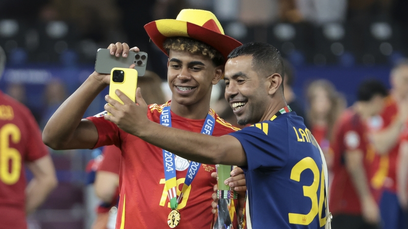 Lamine Yamal poses with his father Mounir Nasraoui following Spain's victory over England in the Euro 2024 final