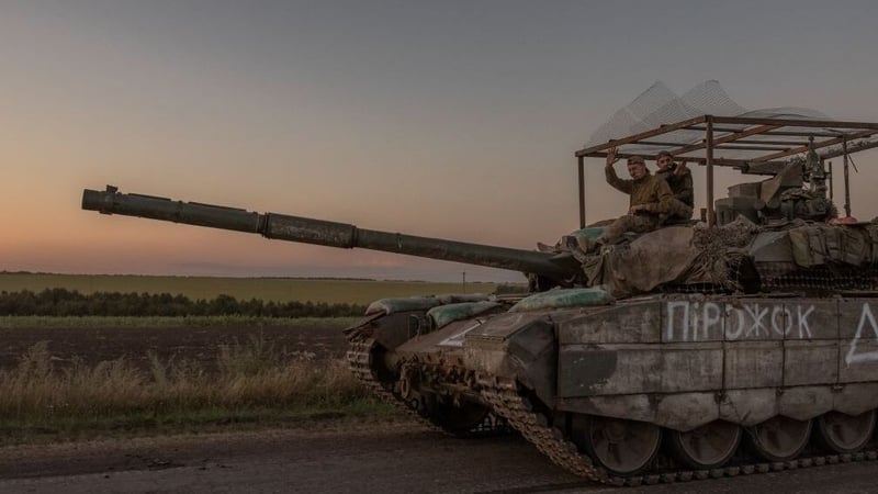Ukrainian servicemen operate a tank on a road near the border with Russia in the Sumy region of Ukraine