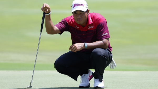 Hideki Matsuyama reads a putt on No 16