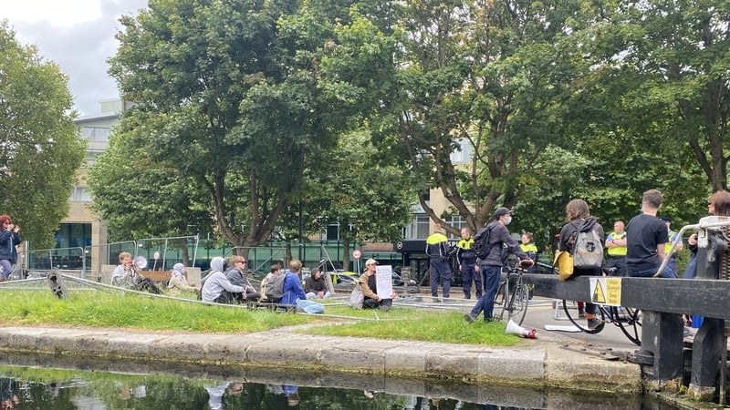 Some protesters have pulled down barriers on the canal bank