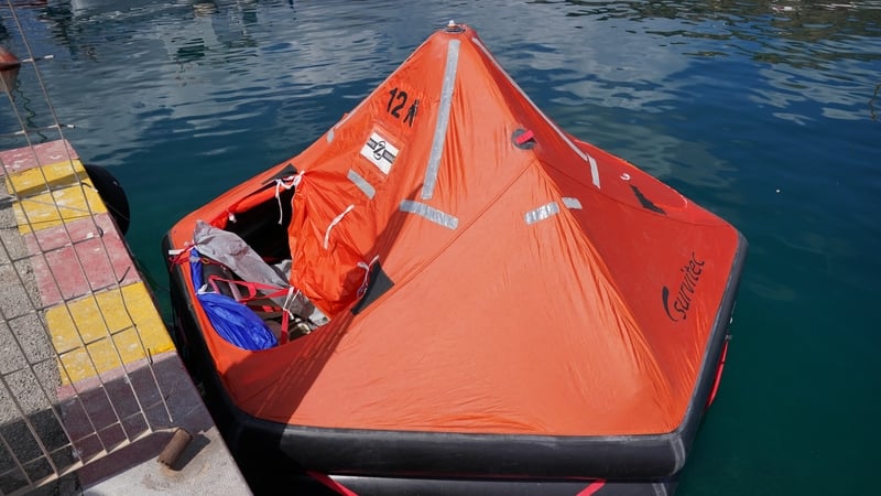The survivors managed to climb into a life raft after the yacht capsized