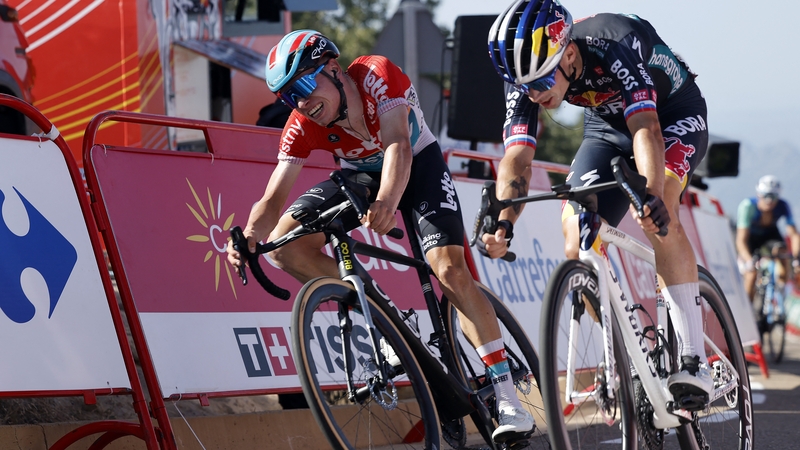 Primoz Roglic (R) crosses the finish line ahead of Lennert Van Eetvelt