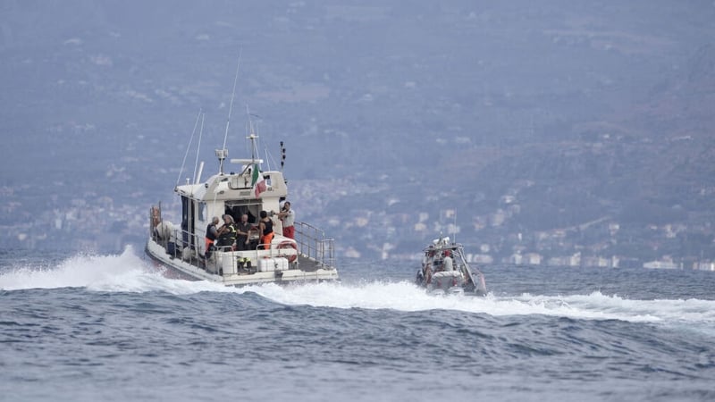 Divers on a vessel at the scene of the search operation