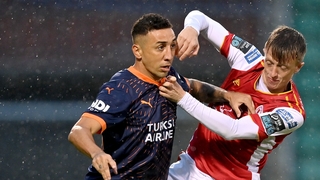 Davidson of Basaksehir is tackled by Chris Forrester