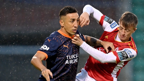 Davidson of Basaksehir is tackled by Chris Forrester