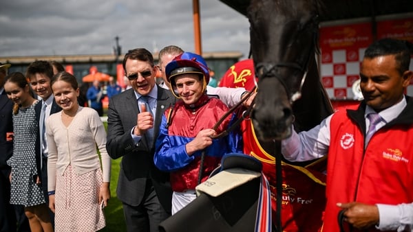 Aidan O'Brien with jockey Ryan Moore following a win in Dubai in June