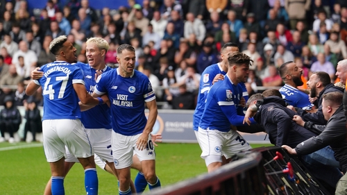 Callum Robinson celebrates his late equaliser at the Swansea.com Stadium