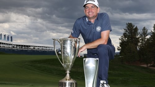 Keegan Bradley poses with the JK Wadley trophy and the BMW Championship trophy