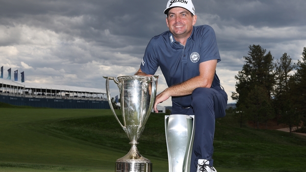 Keegan Bradley poses with the JK Wadley trophy and the BMW Championship trophy